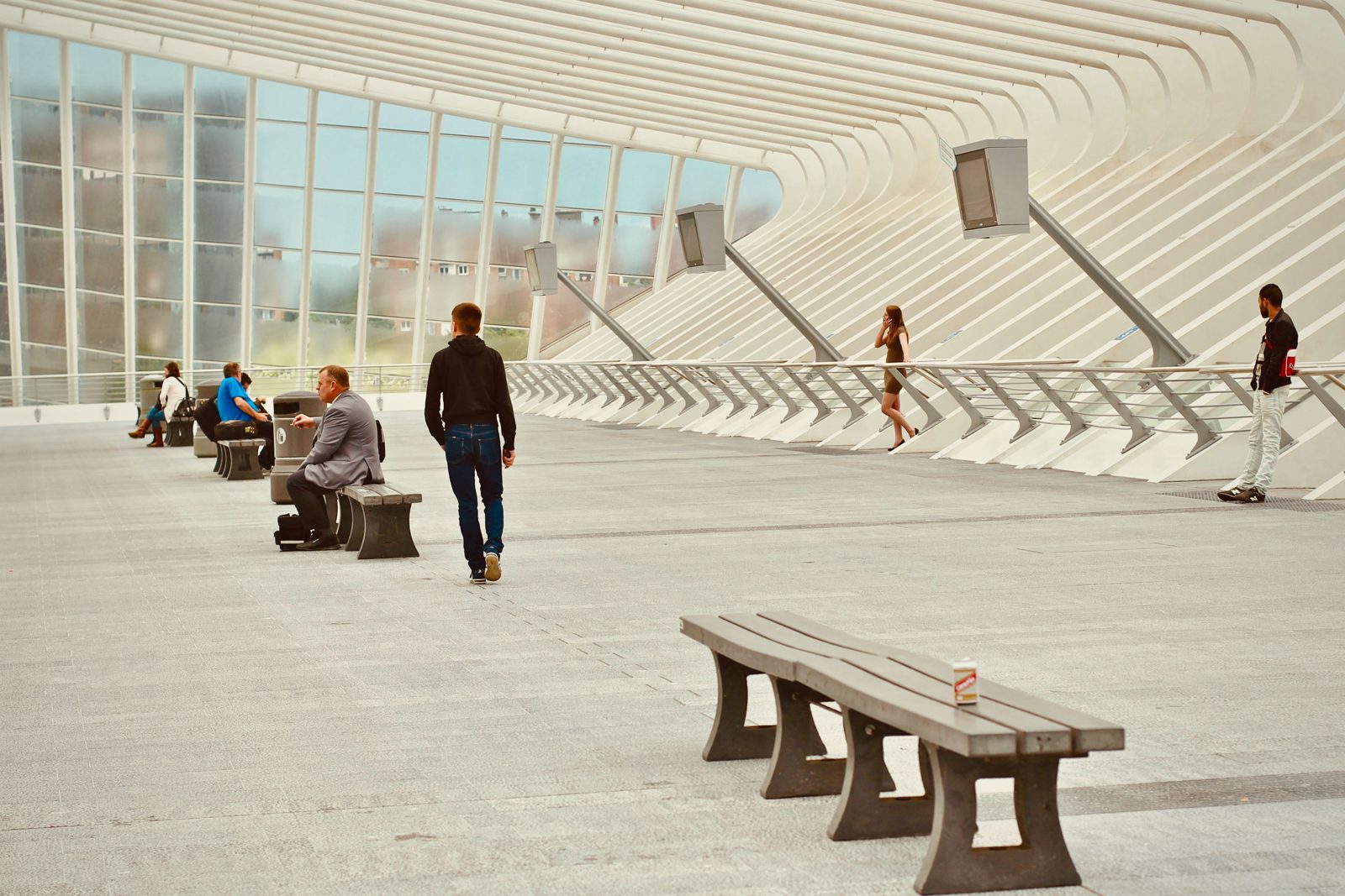 People in a wide, light professional space
